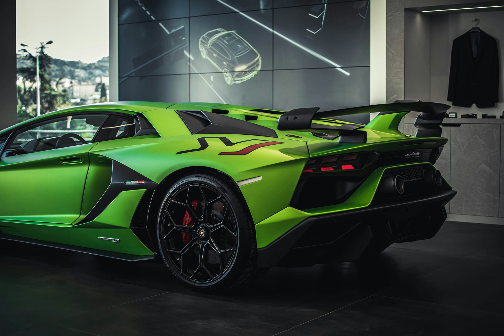 Luxury vehicle in showroom lighting